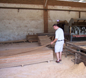 Brazilian hardwood decking being inspected by hand.